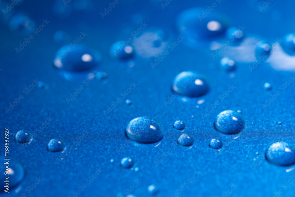 Abstract blur closeup water drops on blue background