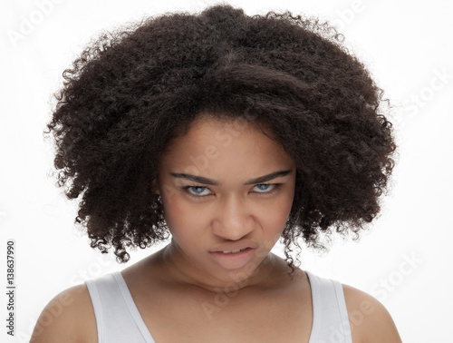 Portrait of a angry young beautiful african teenage, Isolated on white background