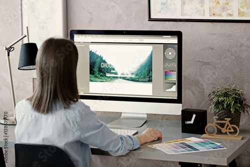 Woman working on computer a...