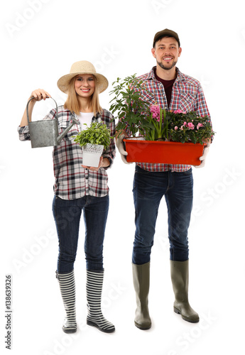 Two florists holding house ...