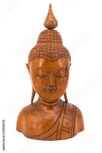 The Smile of Buddha teak wood carving in white background