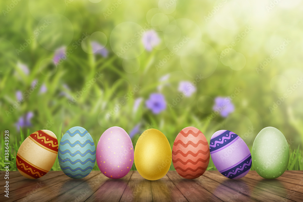 Fototapeta premium Row of Easter eggs on wooden table