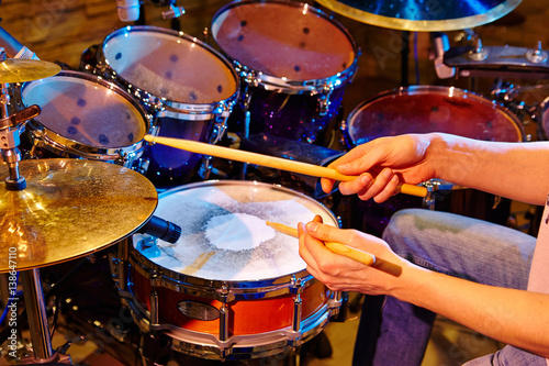 Close Up Of Drummer Playing Drum Kit In Studio
