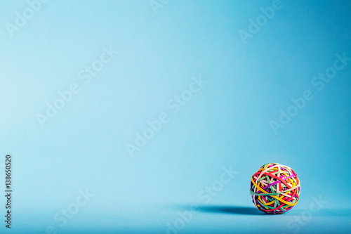 Принти на полотні Rubber band ball on blue background