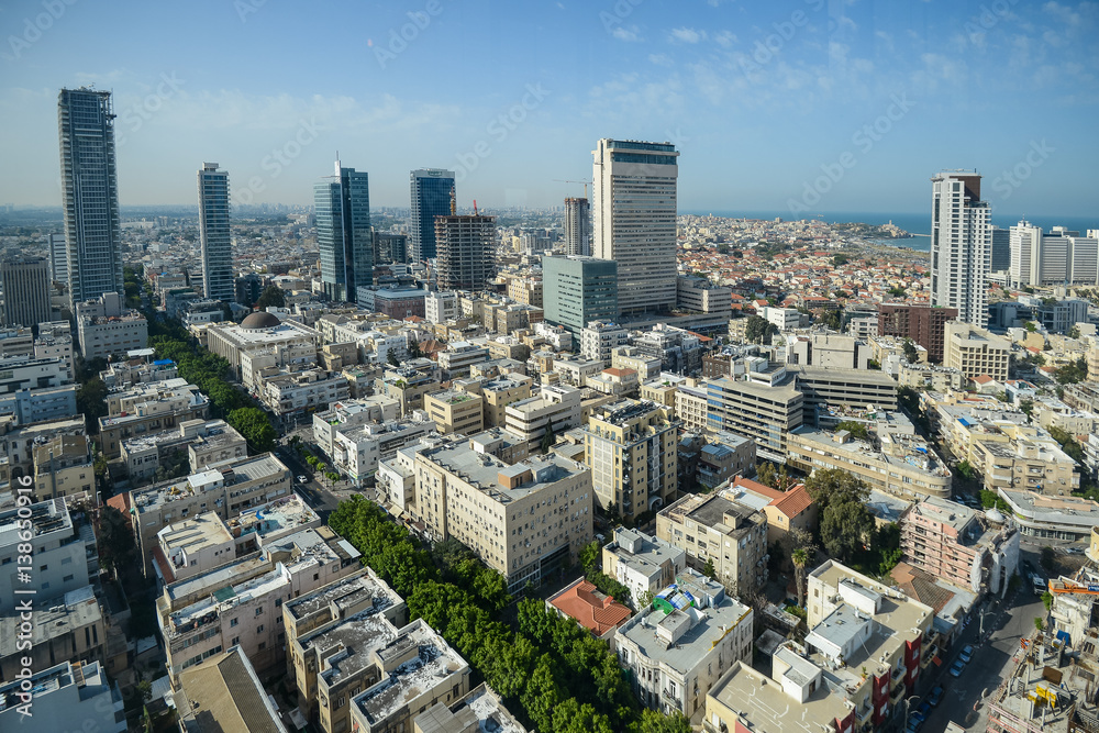Obraz premium Panoramic view on roofs of Tel-Aviv on the modern buildings background
