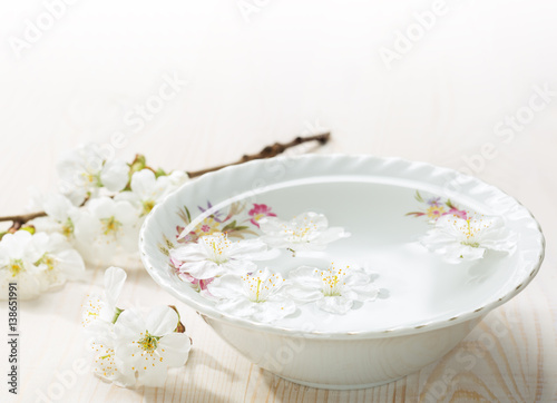 Floating flowers   Cherry blossom  in white bowl.