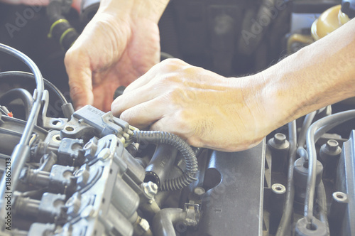 Wallpaper Mural Yong Man check the condition car engine, checking the engine Torontodigital.ca