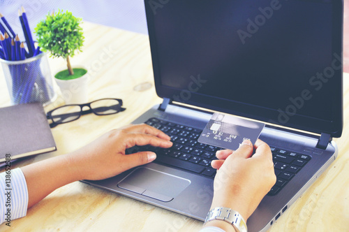 Wallpaper Mural Young Business woman Hand Holding Credit Card Luxury Payment with laptop computer Business Concept Torontodigital.ca