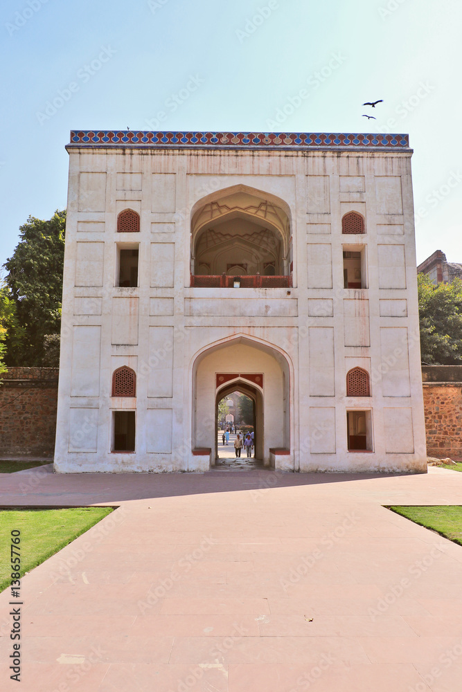One of the entrance of the Mughal Emperor Humayun's tomb. The tomb was commissioned by his wife Bega Begum in 1569-70. Many Mughal rulers lie buried here. One of the entrance of the Mughal Emperor Humayun's tomb. The tomb was commissioned by his wife Bega Begum in 1569-70. Many Mughal rulers lie buried here.