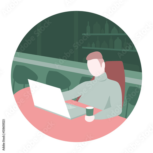 Man sitting in a bar with laptop