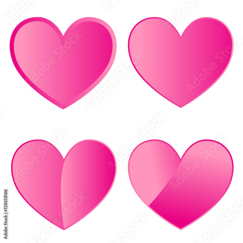 Set of four pink hearts on white background