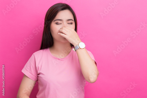 Woman touch her nose