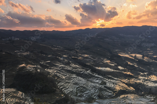 Sunset over YuanYang rice terraces in Yunnan, China, one of the latest UNESCO World Heritage Sites photo