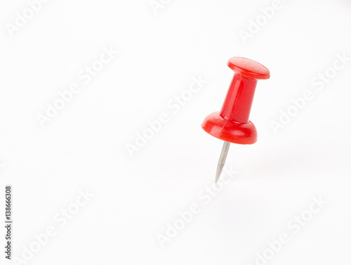 Red Push pin on white background.