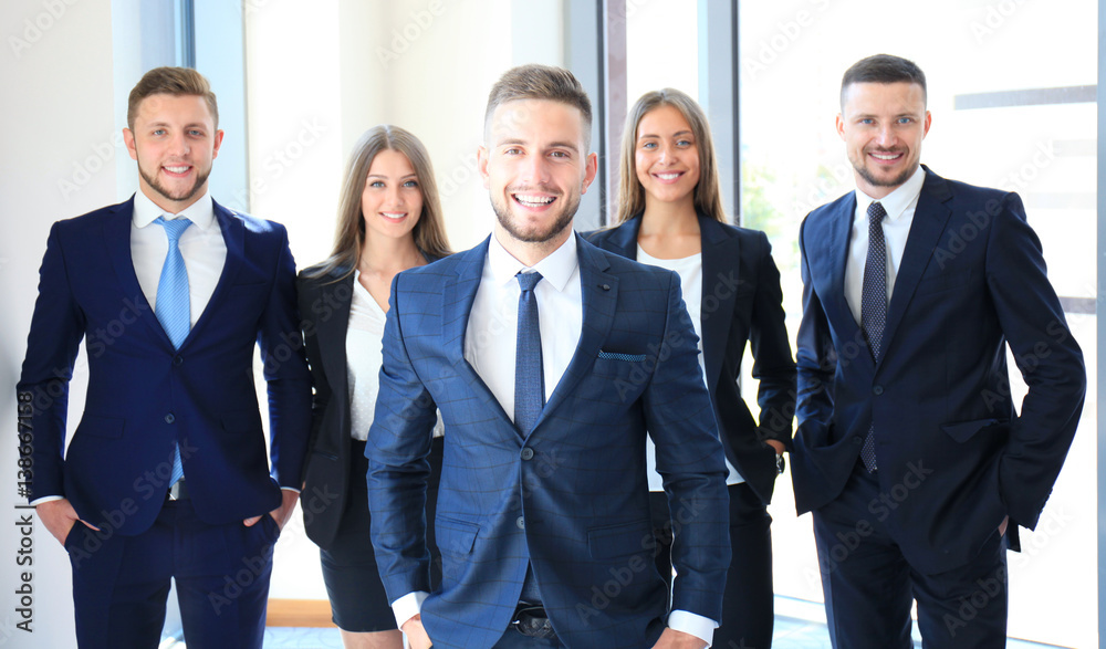 Group portrait of a professional business team looking confidently at camera Group portrait of a professional business team looking confidently at camera