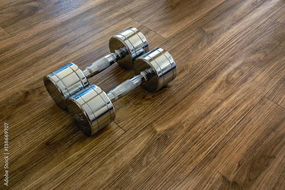 A Pair of Dumbells in a Sport Fitness Room A Pair of Dumbells in a Sport Fitness Room