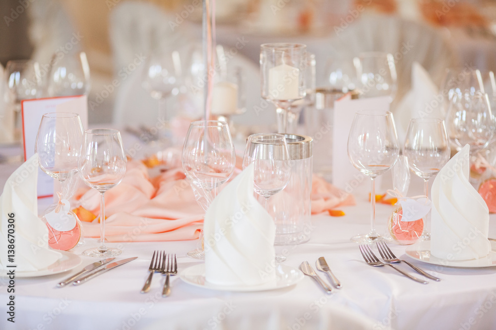 The elegant dinner table with flowers and cards The elegant dinner table with flowers and cards