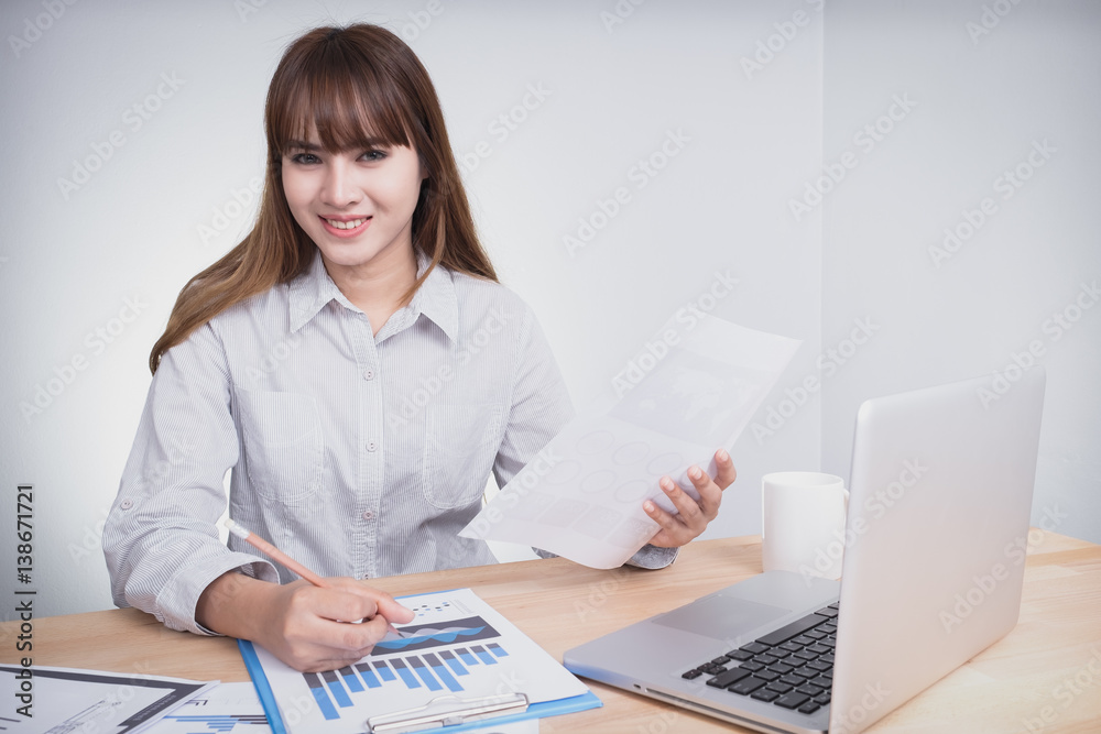 Asian Young woman accountant calculate the accounts, documents laptop. Asian Young woman accountant calculate the accounts, documents laptop.