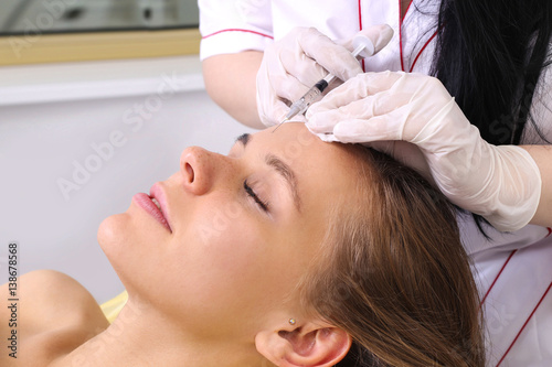 Mesotherapy injections in the face.