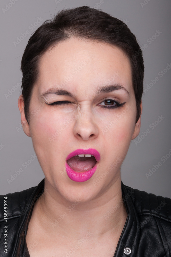 Sexy pretty woman doing eye blink gesture Sexy pretty woman doing eye blink gesture