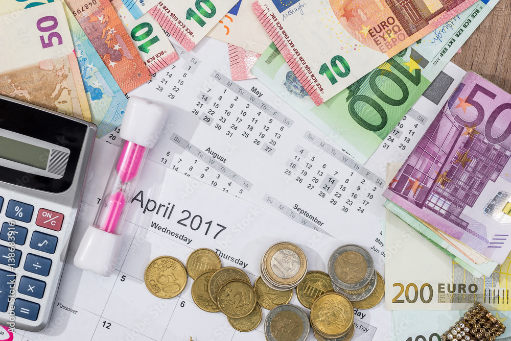 text shopping day write on calendar with euro banknotes, coin, pen. text shopping day write on calendar with euro banknotes, coin, pen.