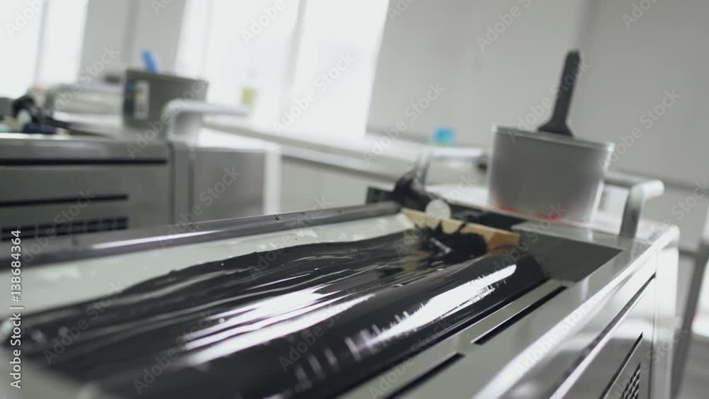 Printing press, black paint mixing shaft, printing production. 4k footage.
Printing press, black paint mixing shaft, printing production. 4k footage.