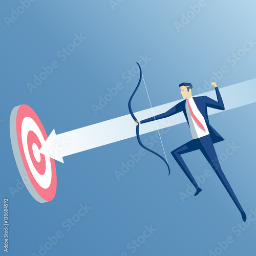 Businessman in jump shoots an arrow at a target. Business concept the purpose and success