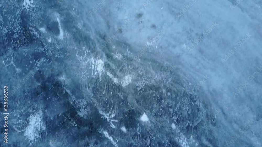 slowly flying over the frozen river covered with snow and ice. Abstraction. Filmed from the top. slowly flying over the frozen river covered with snow and ice. Abstraction. Filmed from the top.