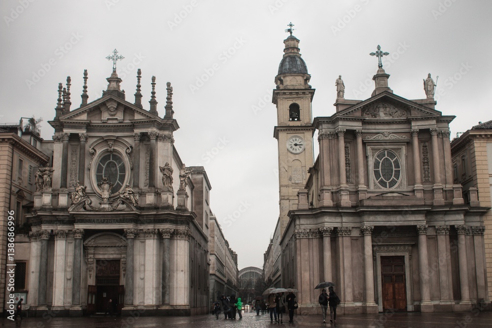 Turin (Torino), Italy - February 15, 2017: Tourists in Piazza San Carlo square and the church in Piazza San Carlo (Chiesa di Santa Cristina e Carlo) 