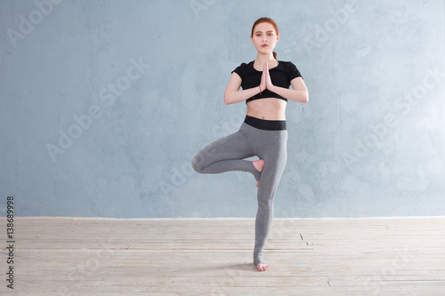 Young woman practicing yoga in a urban background. A series of yoga poses.  Fitness, sport, yoga - concept.