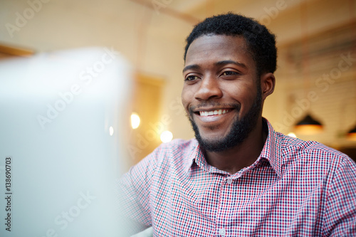 Young designer working in front of laptop