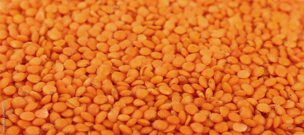 Orange lentil lens close up background Orange lentil lens close up background