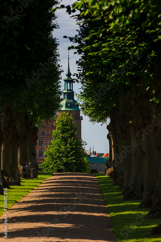 A beautiful summer green ale leading to Frederiksborg Palace in Denmark