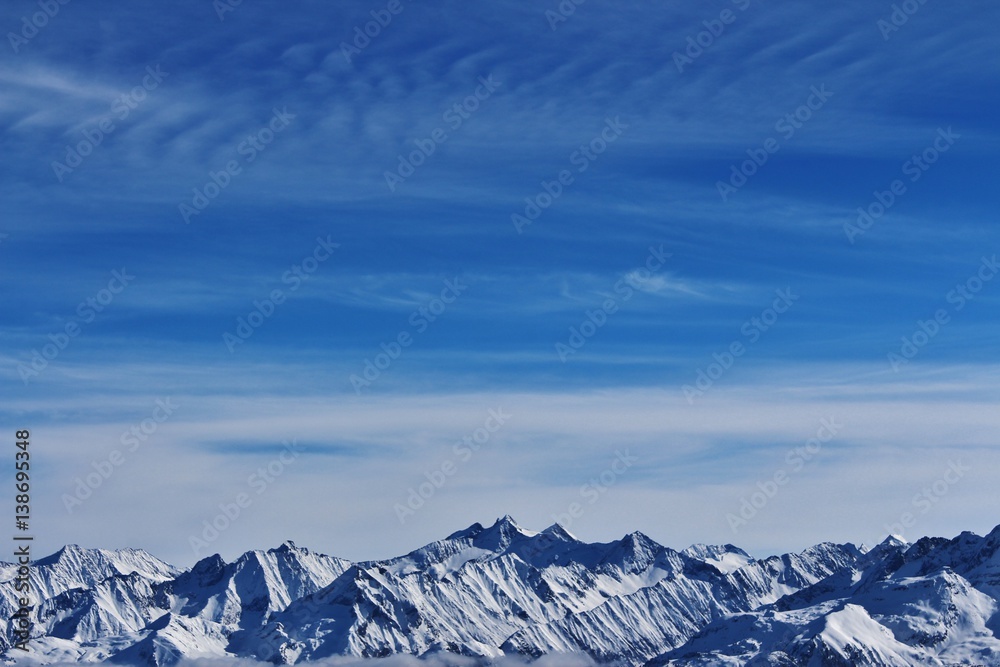Snowy mountains and blue sky in Austria.