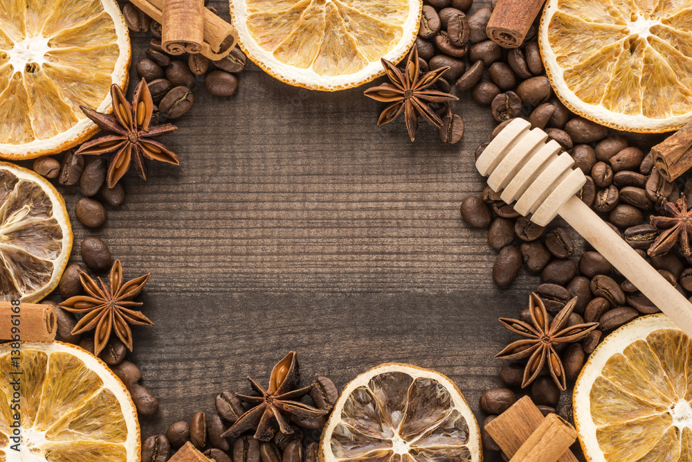 grapefruit and orange slices with coffee beans and spices on wooden background grapefruit and orange slices with coffee beans and spices on wooden background