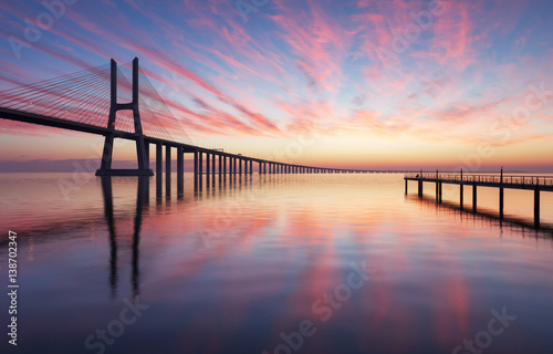 Billede på lærred Vasco da Gama bridge in Lisbon by sunrise, Portugal