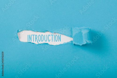 Introduction message on Paper torn ripped opening photo