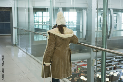 Woman in airport wayting photo