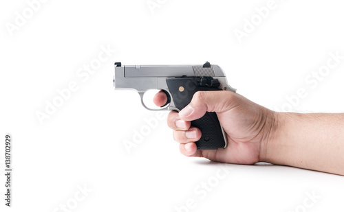 small automatic gun in hand man isolated