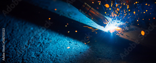 artistic welding sparks light, industrial background photo