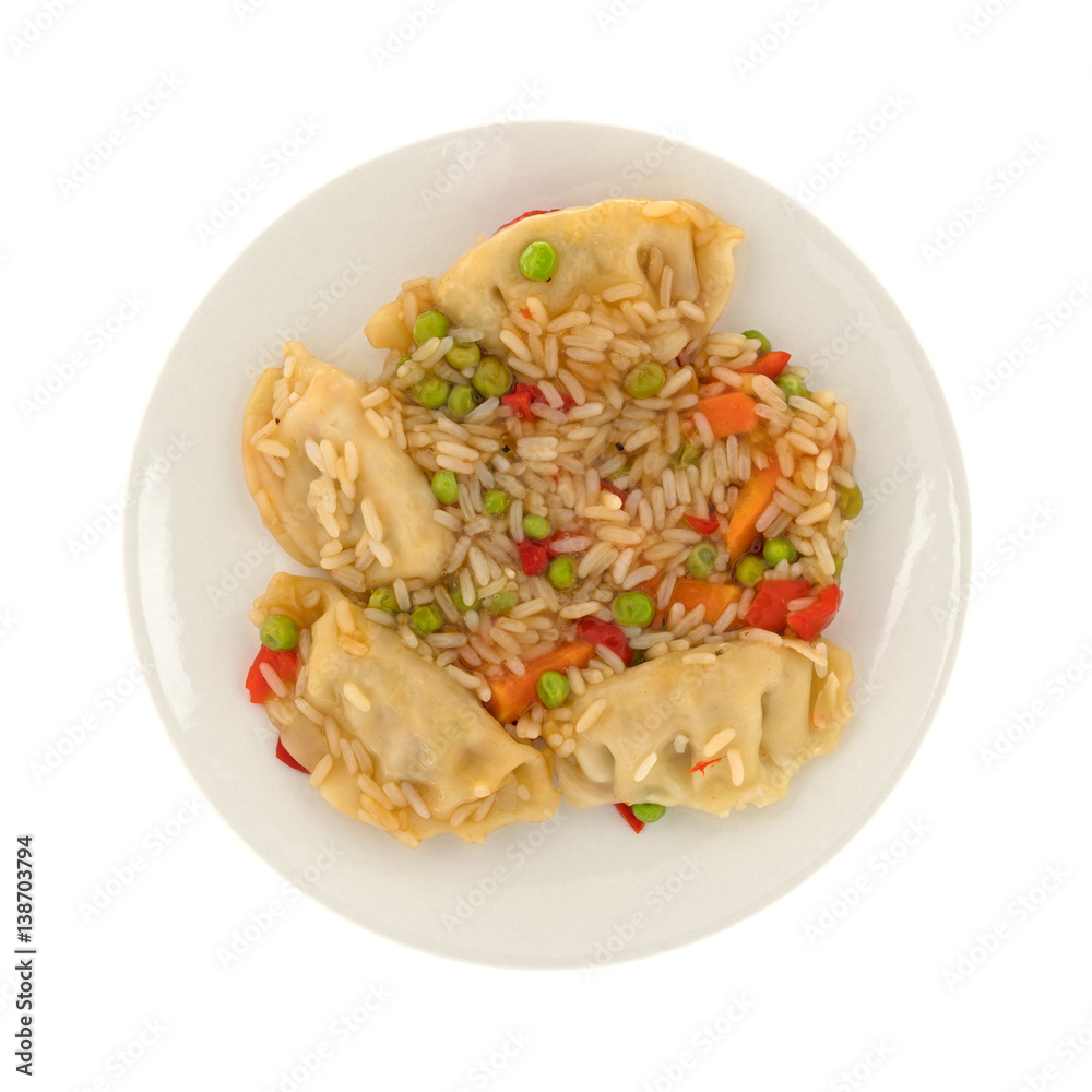 Top view of a vegetarian potstickers meal on a plate isolated on a white background. Top view of a vegetarian potstickers meal on a plate isolated on a white background.