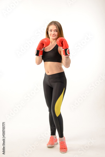Young fitness woman with boxing gloves