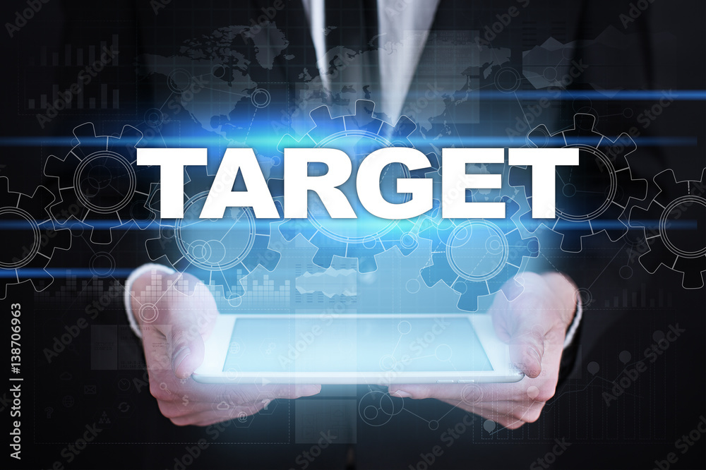 Businessman holding tablet PC with target concept. Businessman holding tablet PC with target concept.