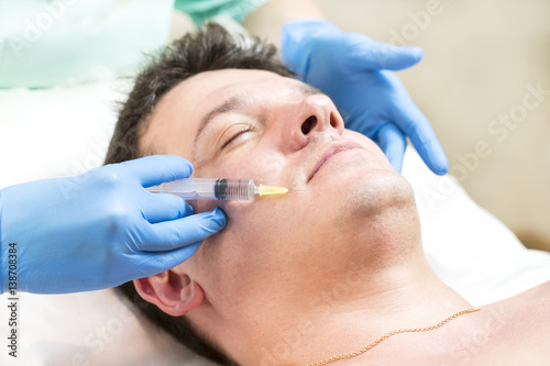 Man passes a course of mesotherapy clinic 