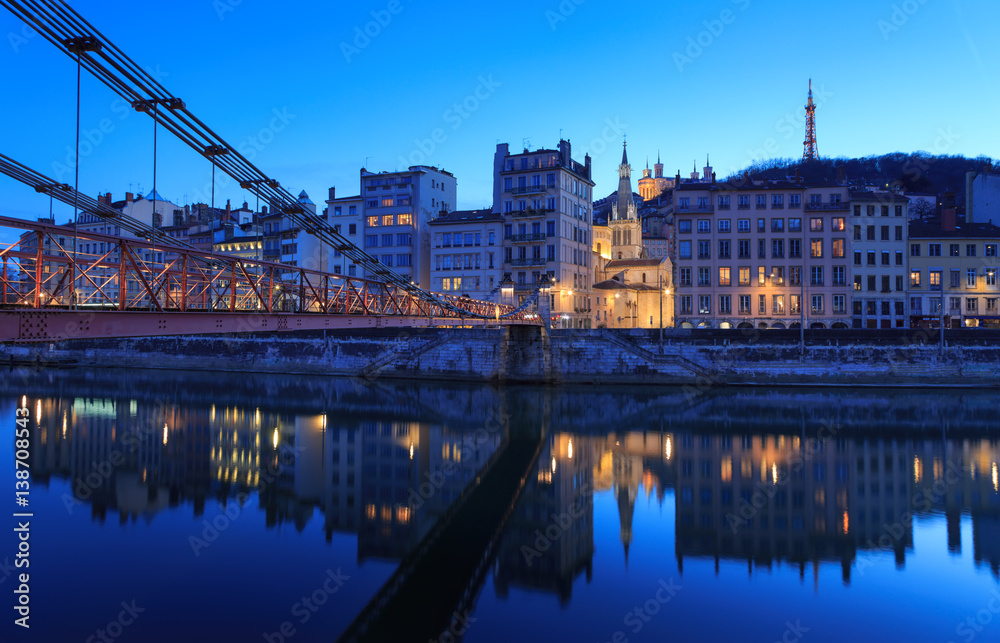 Illuminated bridge, Passerelle Saint-Vincent, over the Saone river in Lyon, France.
