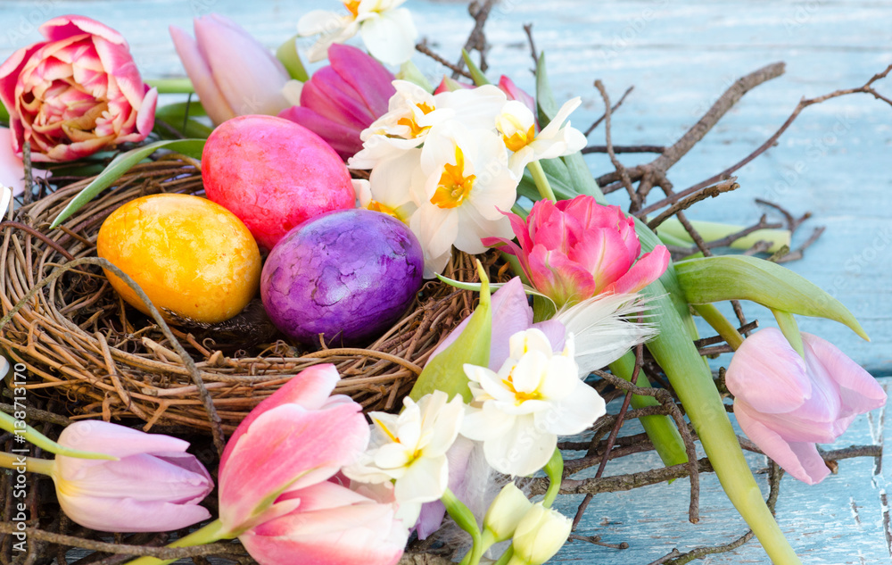 Happy Easter: nest with Easter eggs, feathers, tulips and daffodils:)
