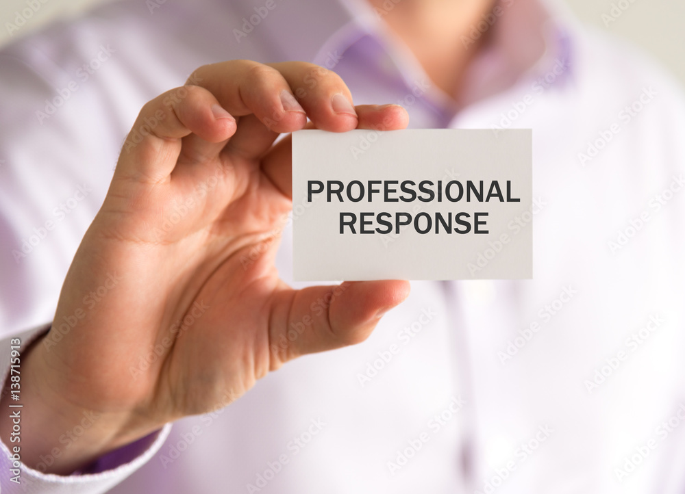 Businessman holding a card with XXXXXXXX message Businessman holding a card with XXXXXXXX message