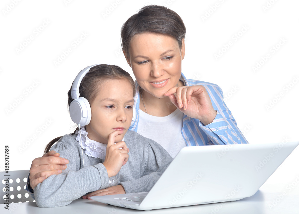 mother and daughter using laptop mother and daughter using laptop