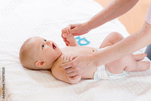 Little newborn baby holding parent hands. Maternity bonding and care.