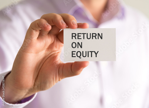 Businessman holding a card with RETURN ON EQUITY message